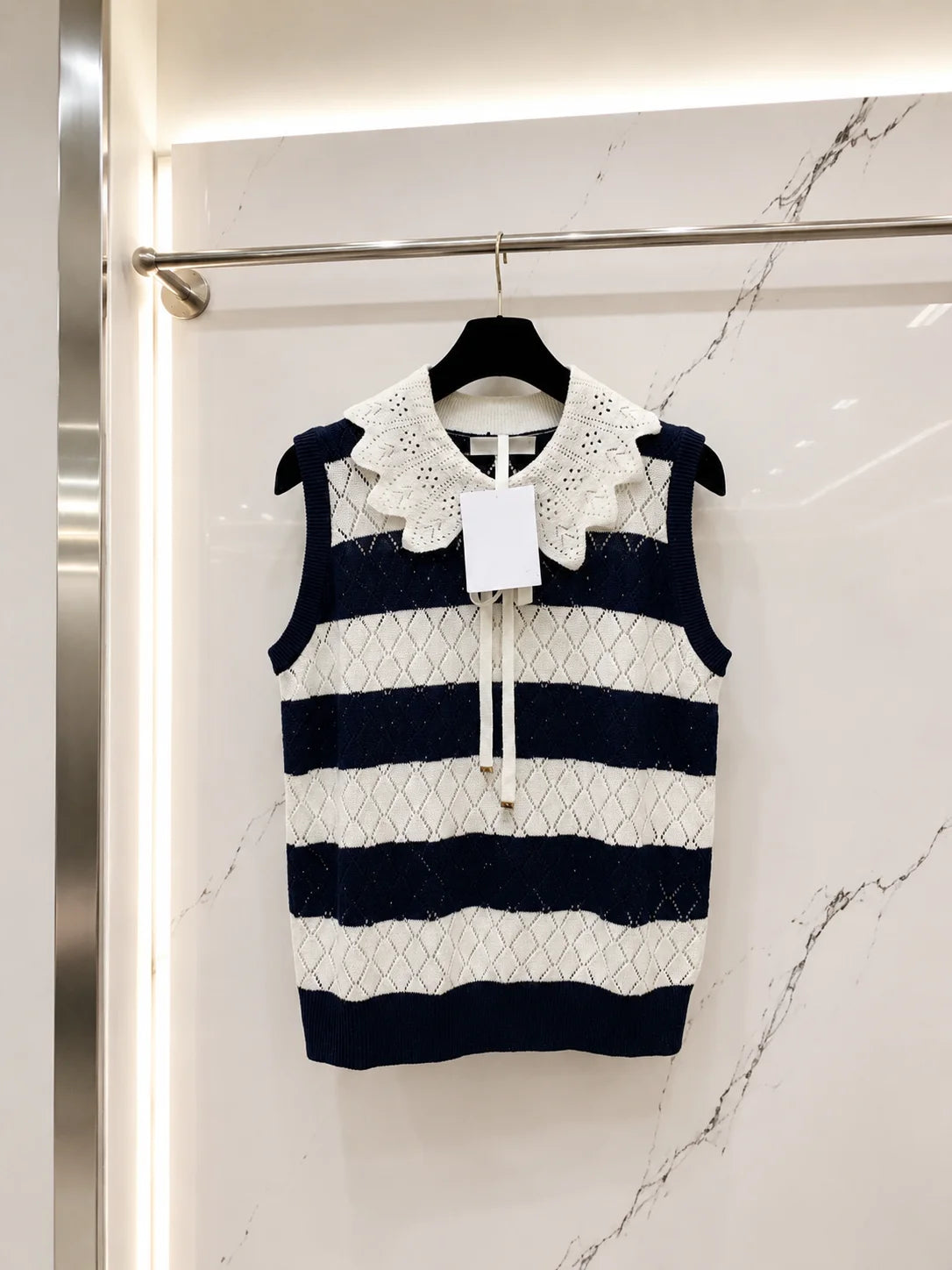 Women Sleeveless Knit Sweater With Eyelet Ruffle Lapel Detail
