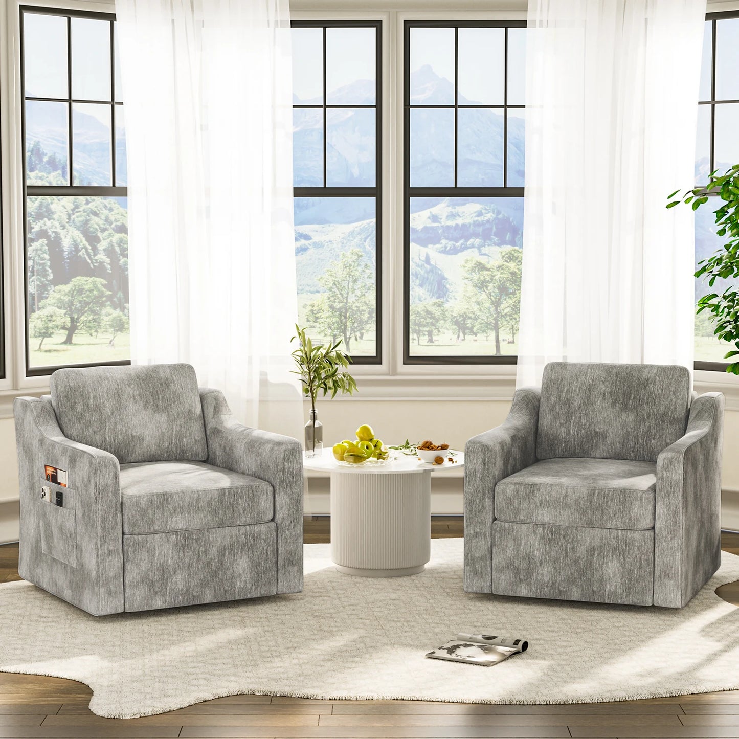 Two gray upholstered 360-degree swivel accent chairs with cushioned seats and back support beside a white round table.